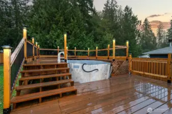 New deck surrounding the above-ground pool.