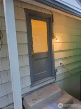 Back door and stairs to unfinished basement
