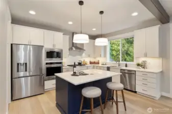 Chef-inspired kitchen with upgraded Kitchenaid appliances and generous prep space.