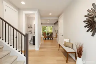 Light-filled entry with clean lines and a warm, inviting flow.  Laminate Hardwood on the main, loft, and 4th bedroom.