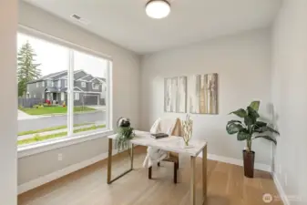 Light filled front main floor bedroom/den.