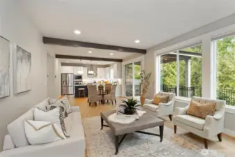 Seamless connection between living, dining, back outdoor space, and kitchen spaces.