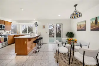 Overlooking the Back Yard, the 2nd (informal) Dining Area is adjacent to the Kitchen. The space is perfection!