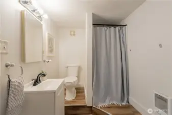Lower-level bedroom with en-suite bathroom.