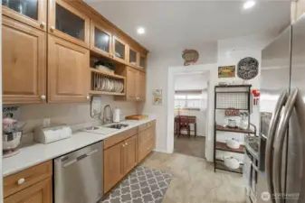 Beautifully remodeled galley kitchen with quality maple cabinets and stainless appliances