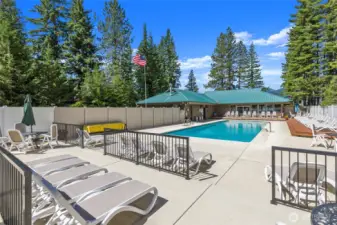 The beach club features a welcoming lodge, an outdoor swimming pool, and pickleball courts, offering a variety of amenities for recreation.