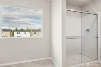 Primary bathroom walk-in shower. Photos are representative only and may display different color packages and/or upgrades.