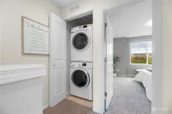 Upstairs landing with full size stacked washer and dryer - entry to Primary Suite #2