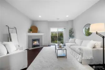 Living room with electric fireplace and balcony access
