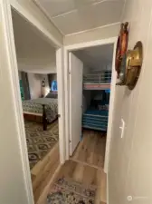 Primary to the left, and currently the 2nd bedroom is used as a bunk room for guests!