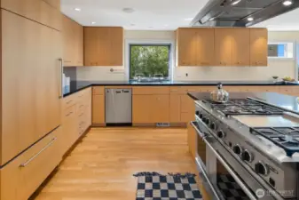 -Profuse cabinetry and ample natural light make cooking all the more fulfilling in this bright kitchen.