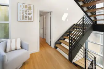 -Obscured glasswork shoots up from the main to the rooftop deck, offering both privacy and point of view.