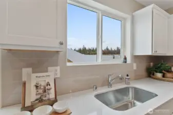 See supplements for colors in home. Home has gray cabinets.