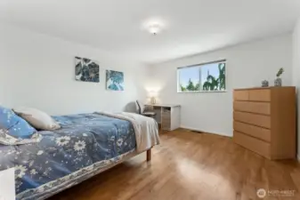 Bedroom 2, all with hardwoods and beautiful nature beaming in from outside.