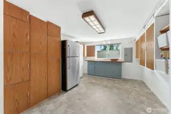 Did I mention...huge laundry/storage area!  Amazing storage with built in cabinets and shelving, plus extra fridge stays with the house!