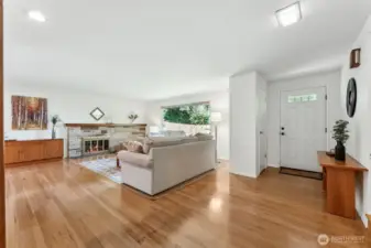 Enter to gleaming hardwoods, a spacious living room and a beautiful stone, woodburning fireplace.