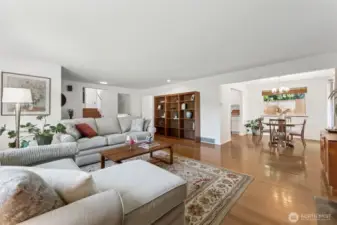 This view is from the fireplace in the living room, to the dining area and entry to kitchen.  The slider off the dining room leads you out to a private deck and gorgeous yard with fresh fruit and flowers!