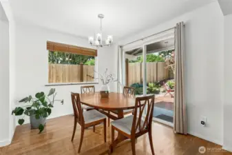 You start to see a glimpse of the outdoor beauty here through the dining room slider.  Beautiful hardwoods, new lighting and great natural light are great indoor perks, and the great party deck will move you outdoors as our summer comes into view.