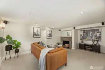 The lower-level family room with gas fireplace is a perfect place to watch a game, movie, or host a game night!
