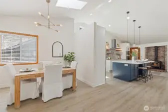 See how the dining room flows into the kitchen. Skylight adds natural light.