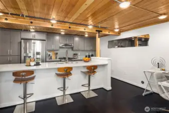 Spacious kitchen with quartz countertops and convenient breakfast bar