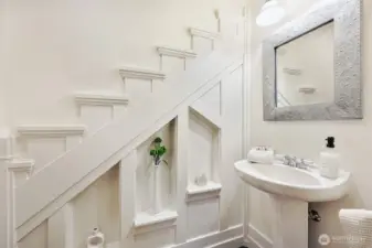 Powder room in den has wonderful woodwork!