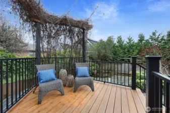 Welcoming seating area. Trellis with vine adds to privacy and is a showy display in the Spring and Summer.