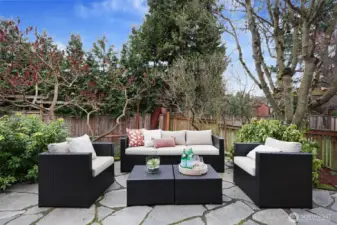 Generous seating area on flagstone patio