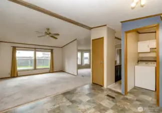 View of the family room, living room, and utilties room from the kitchen