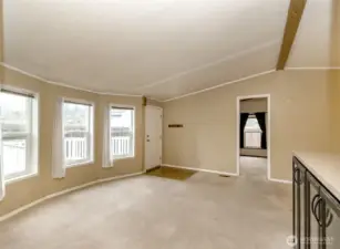 Living room entry into the primary bedroom suite