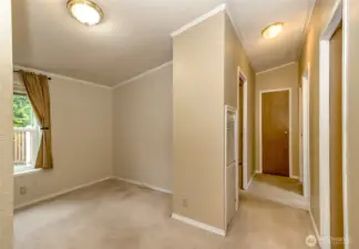 Open concept office den behind the