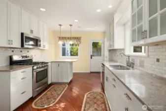 Kitchen with granite counters and tile backsplash