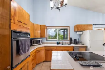Kitchen with views of backyard