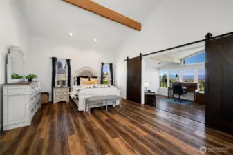 The upper-level primary suite isn’t just a bedroom—it’s a private sanctuary. With a spacious layout that flows into a flexible bonus/ third bedroom, a private balcony and a loft-style office just beyond, this elevated retreat offers room to unwind, work, create, or simply breathe. Whether you envision a peaceful reading nook, an art studio, or a luxe lounge, the possibilities are endless.