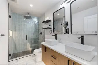 Fantastic primary bath w/large shower, dual floating vanities & custom lighting with motion sensors for under cabinet & soap niche lights
