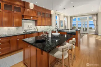 Kitchen looking west. Beautiful custom cabinetry by Baywood Cabinets.