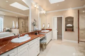 Large Ensuite Bath with travertine marble flooring and marble countertops.