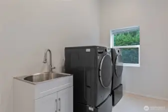 Laundry Room: extra large capacity washer and dryer, sink, ceiling fan.