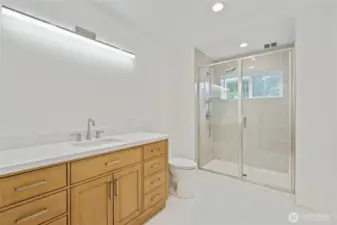 Primary Bath: Shower includes double shower heads and window. Radiant floor heat.