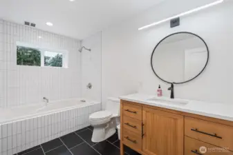 Main Bath: large 2-person jetted soaking tub, radiant floor heating.