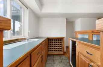 Bonus room with bar set up, mini fridge and sink