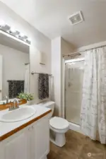 Main bathroom features a walk in shower. Perfect for Multi-generational living.