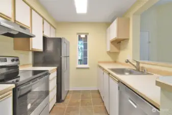 Roomy kitchen with new dishwasher and range