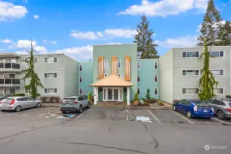 Mid-century building with elevator and reserved parking near the front door.