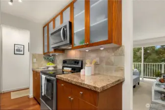 Stainless appliances, slab granite counters and hardwood floors.