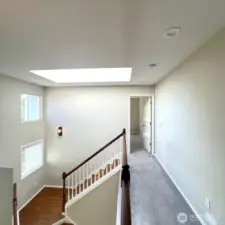 Staircase Looking to Primary and Skylight