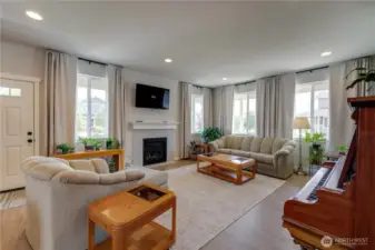 Large open concept with gas fireplace.