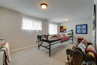 LARGE Bonus room or 5th bedroom. For an idea on size, that piece of equipment needs 14 feet!