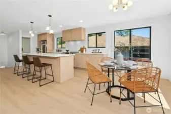 Enjoy every meal with those you hold dear in this dreamy kitchen! Lavish cabinetry, stainless appliances, quartz counters, huge island and pantry! And lots of golden accents! Ooolala!