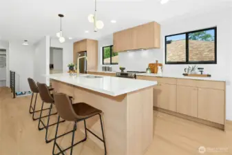 A very well-thought out design complete with an integrated vent hood to match the cabinetry. Plenty of prep space too.
